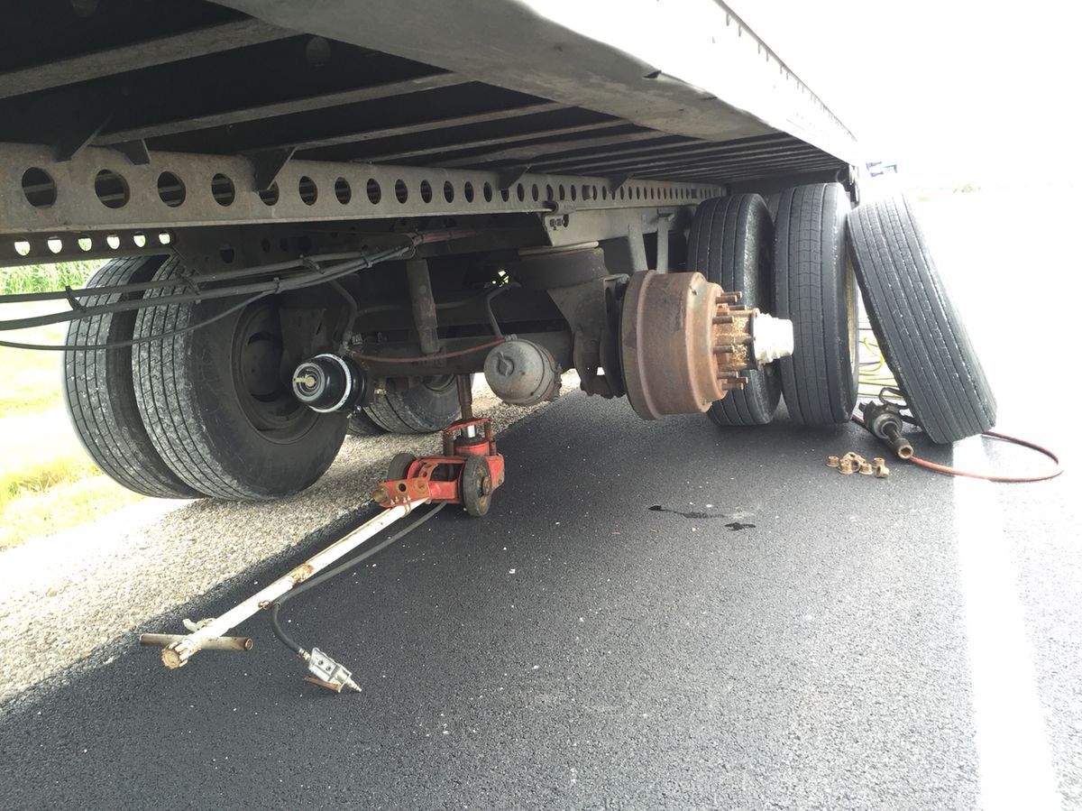 Heavy duty truck tire being changed roadside